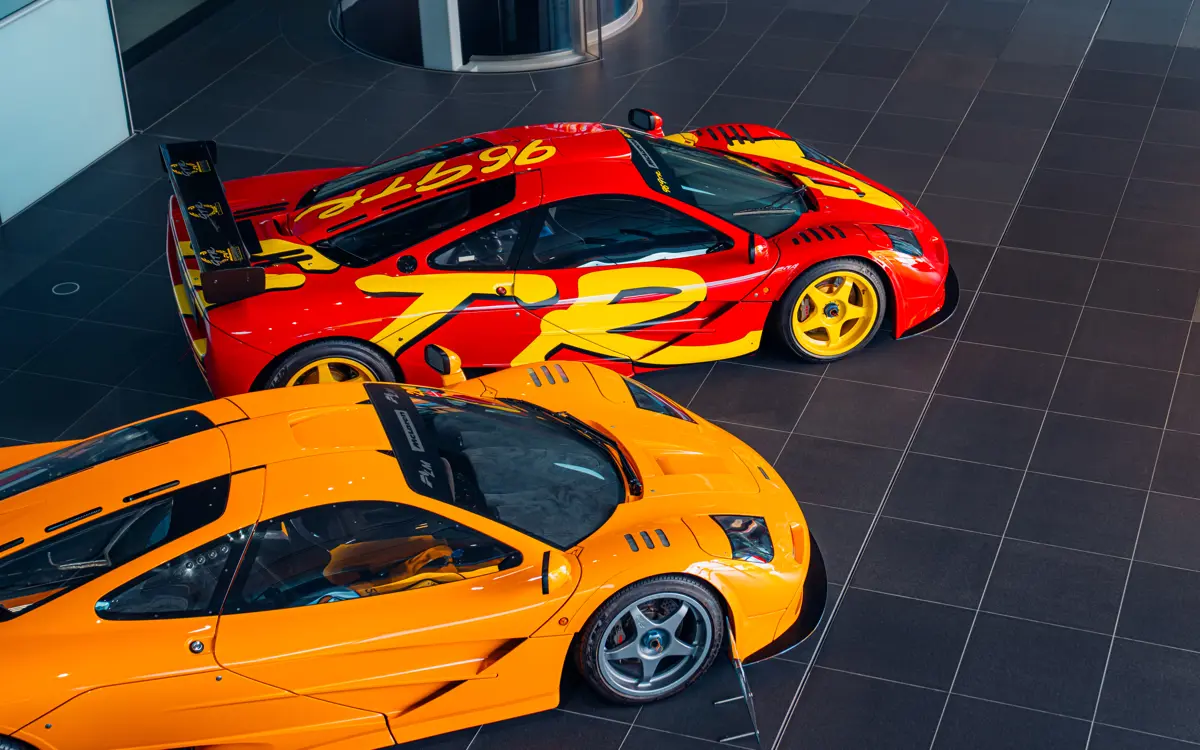 The 1990s pop art-inspired McLaren livery in scarlett red and yellow stands out next to a bright orange McLaren.