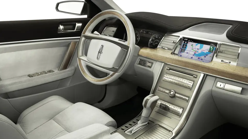 The Lincoln MKS interior is wrapped in genuine materials, including Silvered Birdseye maple, polished alloy, and Oxford Grey suede.

