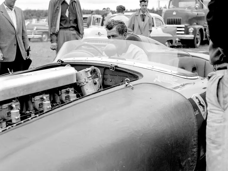 Carroll Shelby grins at the sweet sounds being made by his Ferrari, chassis no. 0478 AM (#103), in the paddock before the start of the feature race at the 31 July 1955 SCCA Nationals held at Bremerton, Washington.