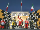 Loris Capirossi, Valentino Rossi, and Marco Melandri during the awards ceremony after the 2006 Grand Prix of Japan.