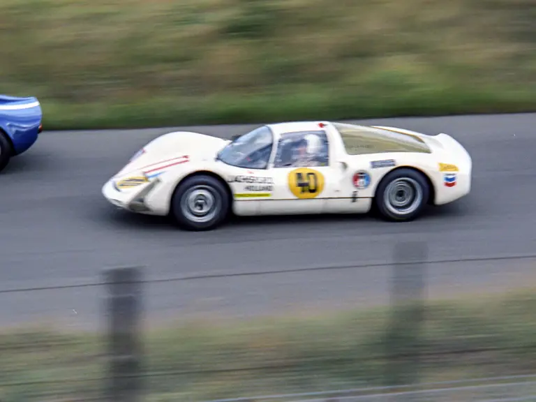 Ben Pon is captured overtaking at the 1966 Trophy of the Dunes at Zandvoort, later going on to win the race.