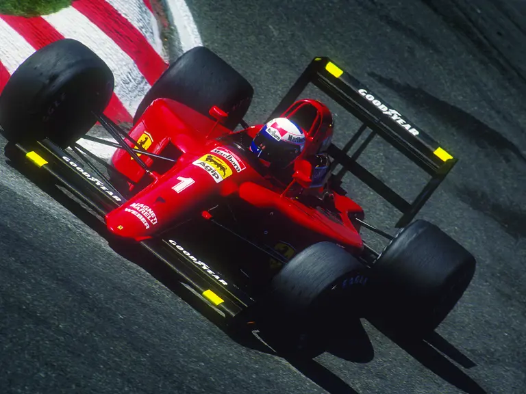 Chassis 121, with Alain Prost behind the wheel cornering hard at the 1990 Spa-Francorchamps Grand Prix.