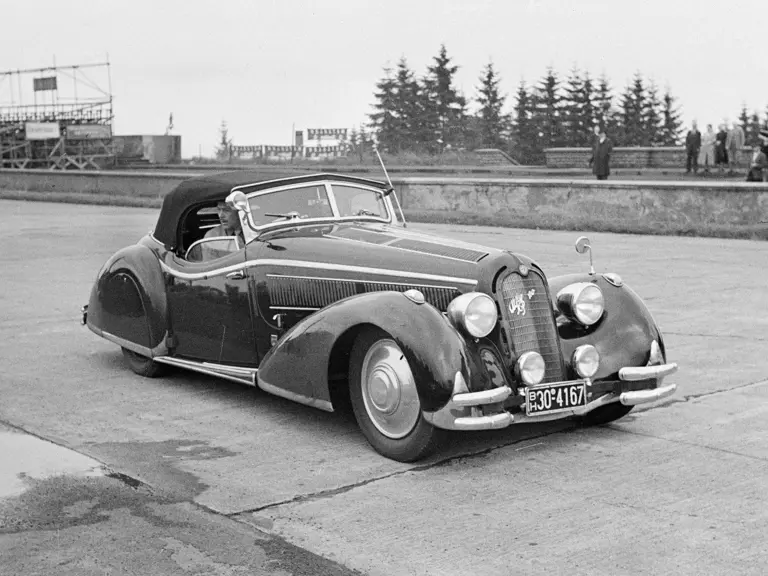 Pictured here at the Nürburgring Nordschleife in anticipation of the 1951 German Grand Prix, the 8C 2900 notably wears its Nowack cabriolet body at this point.