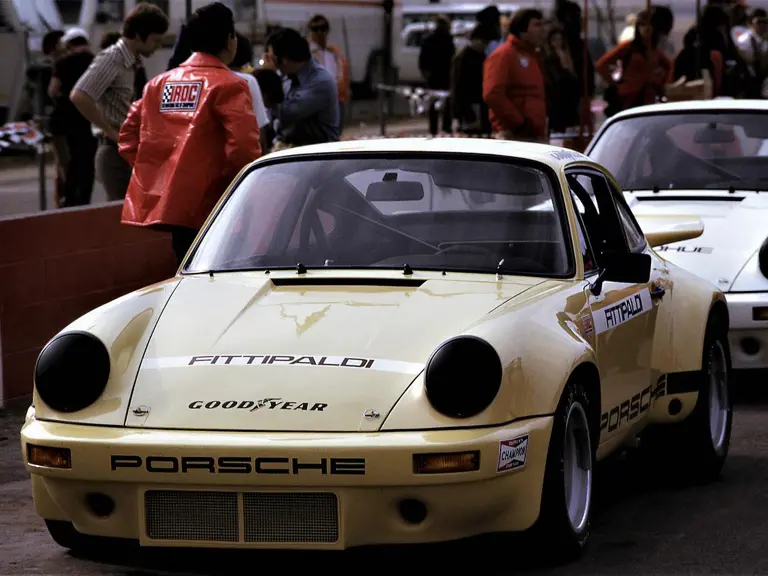 Having just secured pole position for the inaugural IROC race at Riverside, the Sahara Beige chassis of Emerson Fittipaldi waits in pit lane for the application of its #1 race livery by IROC staff.