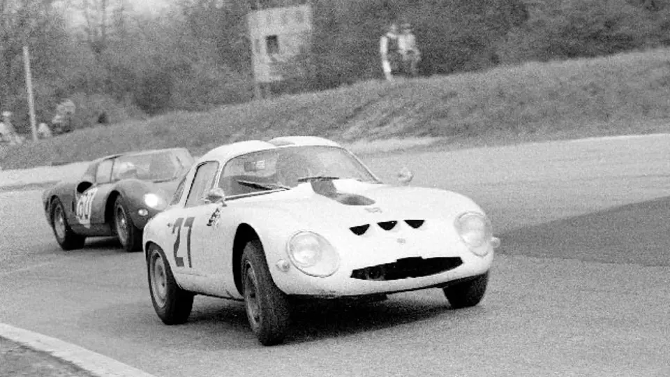 Chassis number 750061 (#27) leads SEFAC Ferrari 330 P2 (#60) through a turn at the 1965 1000 KM of Monza. Chassis number 750061 (#27) leads SEFAC Ferrari 330 P2 (#60) through a turn at the 1965 1000 KM of Monza.