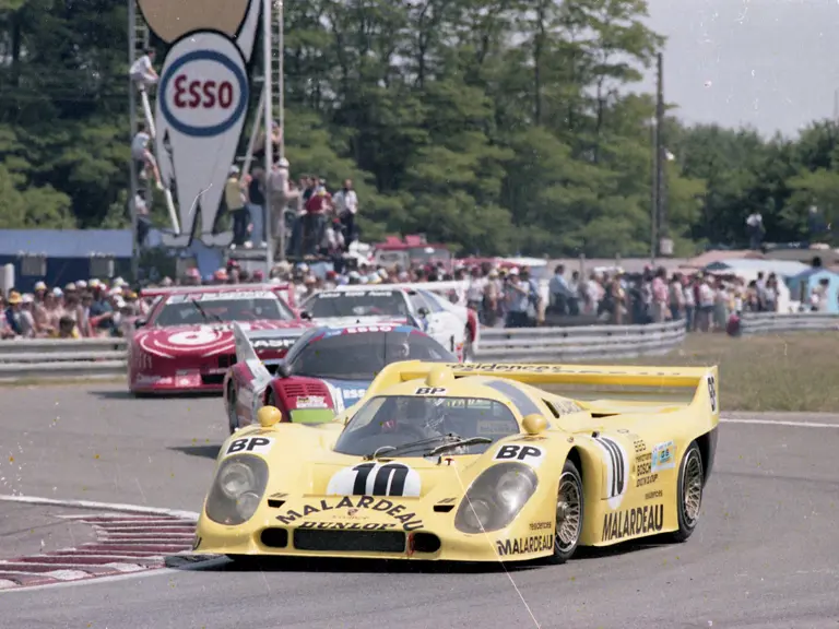 The 917 K-81 wears the race number 10 as it leads the pack through the Ford Chicane at the 1981 24 Hours of Le Mans.
