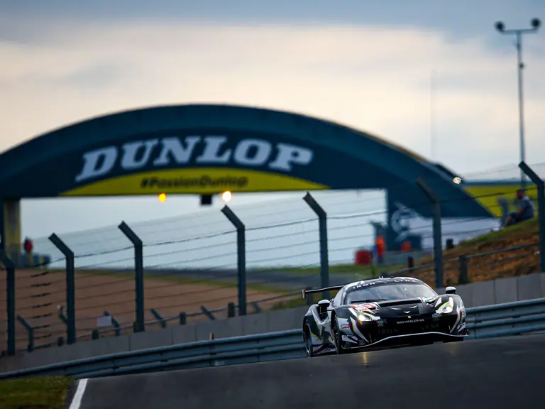 The 488 GTE Evo dashes past the Dunlop Bridge in the final hours of the 2021 24 Hours of Le Mans.