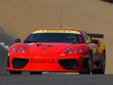 011 M at speed during the first round of the 2002 British GT Championship at Brands Hatch, where it finished fourth overall and third in class.