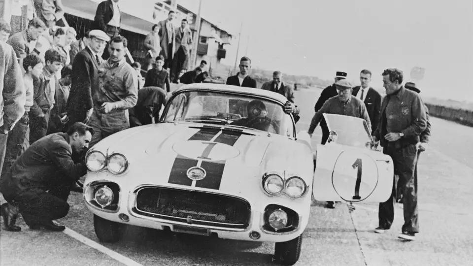 Dick Thompson (behind the wheel), Briggs Cunningham (side of door), and Alfred Momo (behind door) at the 24 Hours of Le Mans test day, April 1960.