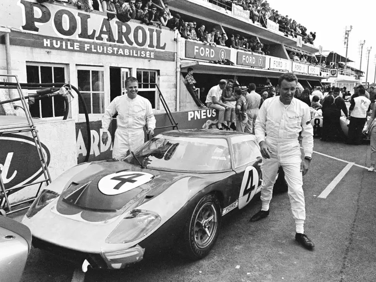 Holman-Moody’s #4 Ford GT40 Mk II (P/1032) and drivers Mark Donohue (left) and Paul Hawkins (right) at the 1966 24 Hours of Le Mans.