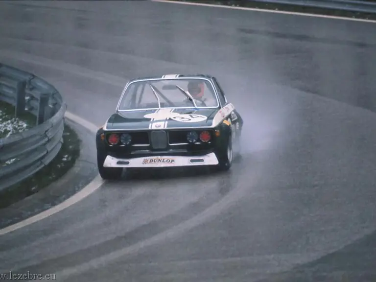 John Fitzpatrick hustles chassis 2211343 on its competitive debut to 3rd place at a sodden Salzburgring in April 1972.