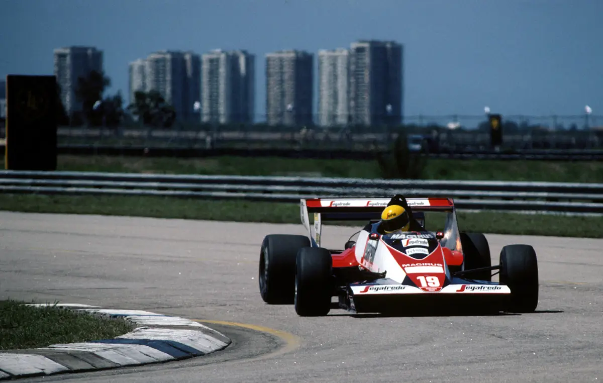 The Rio de Janeiro cityscape provides the backdrop as Senna heads for another apex.