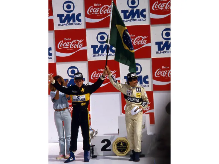 Senna on the podium with Nelson Piquet following the 1986 Brazilian Grand Prix.