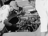 Two race mechanics carry out pre-race checks on chassis 5042 before the start of the 1953 SCCA National March.