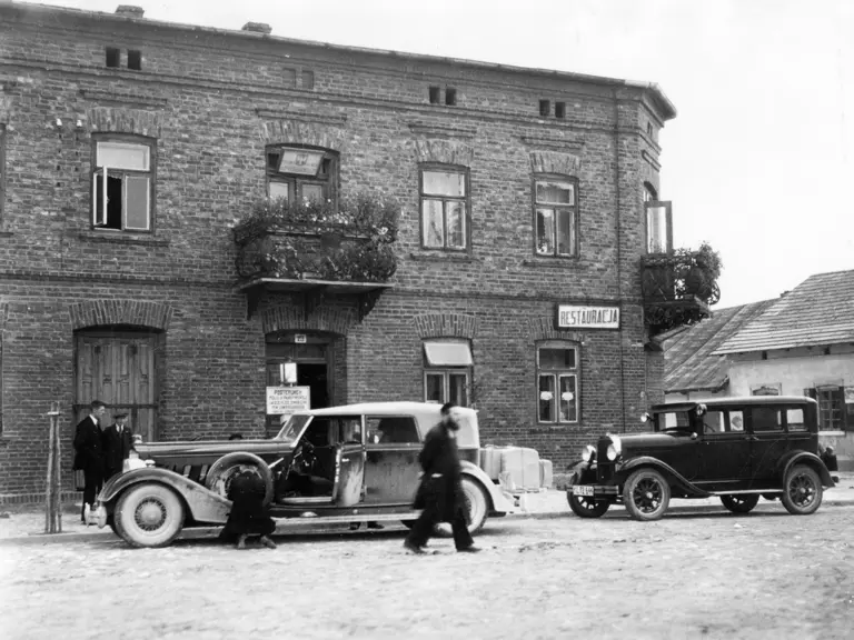Parked on street in front of restaurant in Kozieglowy, Poland - August 12, 1934.