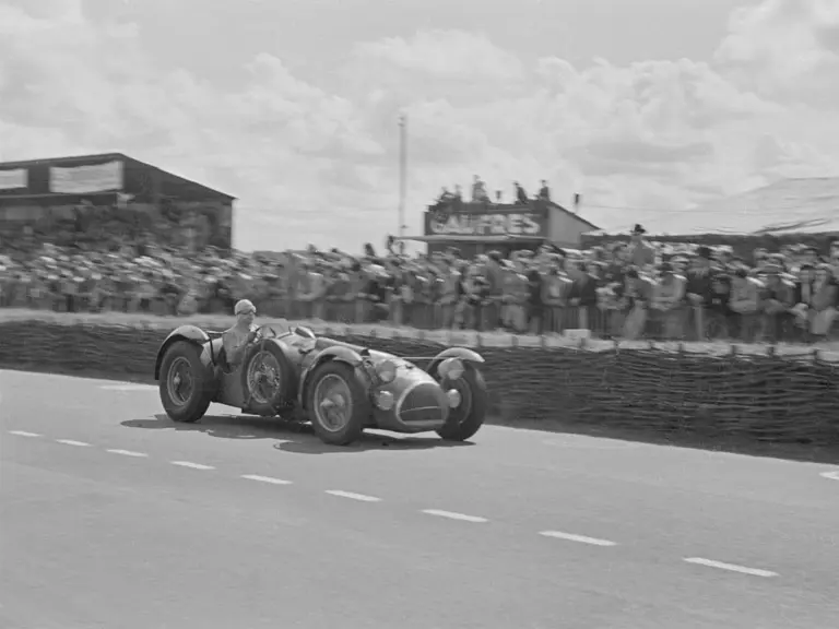 Guy Mairesse passes spectators in his first race aboard chassis 110059, the 1951 24 Hours of Le Mans.
