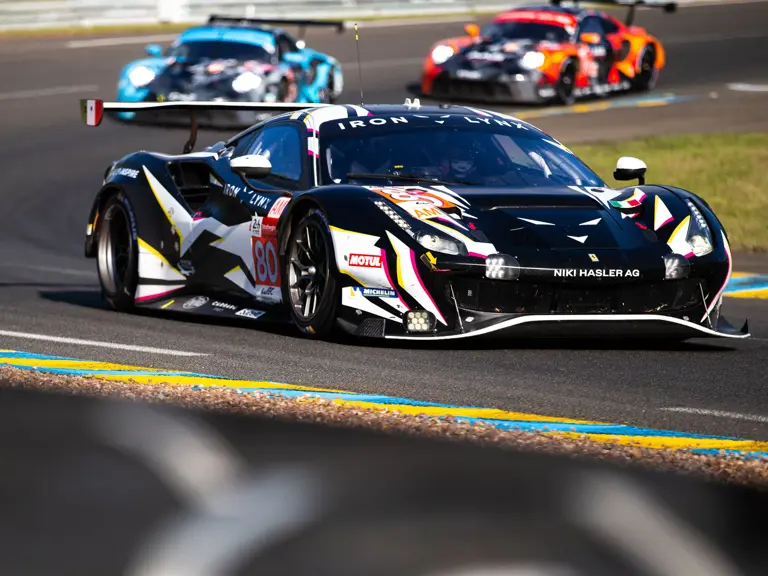 The Iron Lynx Ferrari 488 GTE Evo leads two Porsche 991 RSRs at the 2021 24 Hours of Le Mans.