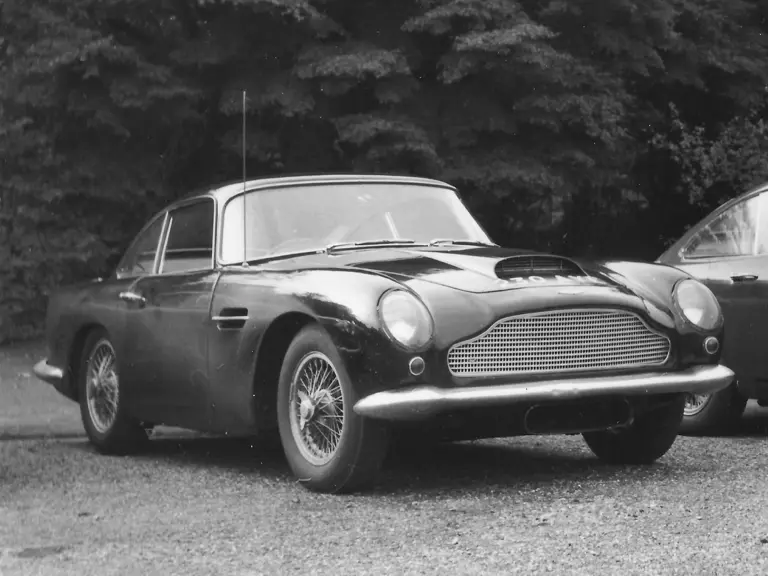 The DB4 GT is pictured in Fort Belvedere in 1969. When new, the car had rounded front bumpers and four cooling scoops.
