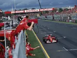 Michael Schumacher, Ferrari F2001, raises his arm in victory, as the Ferrari mechanics celebrate during the Australian GP at Melbourne Grand Prix Circuit on March 03, 2002 in Melbourne Grand Prix Circuit, Australia.