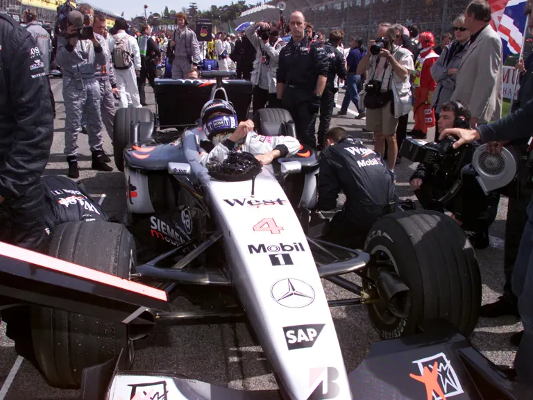 David Coulthard lowers himself into chassis MP4-16A-05 at the 2001 San Marino Grand Prix, where he would finish 2nd.