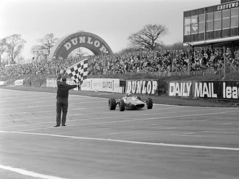 Rich Ginther crosses the line at the 1967 Race of Champions at Brands Hatch.