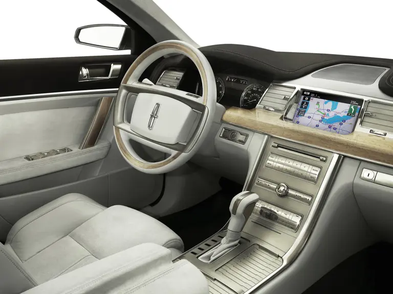 The Lincoln MKS interior is wrapped in genuine materials, including Silvered Birdseye maple, polished alloy, and Oxford Grey suede.

