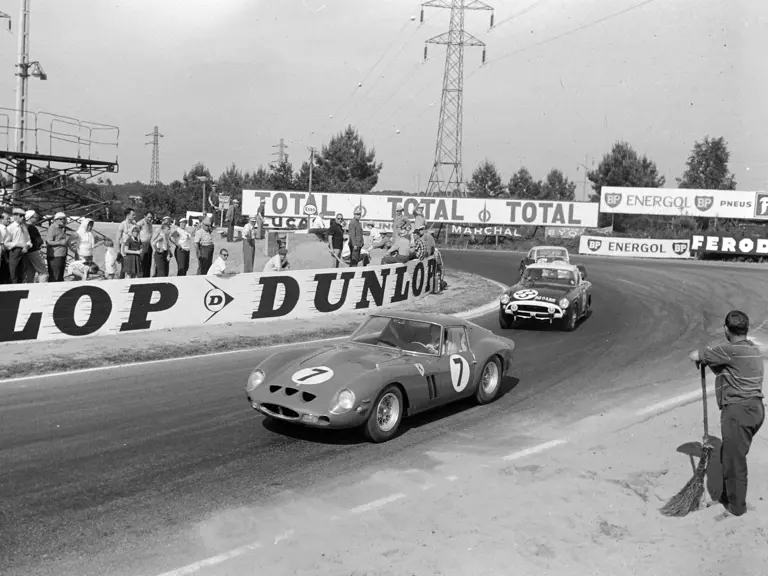 CIRCUIT DE LA SARTHE, FRANCE - JUNE 24: Mike Parkes / Lorenzo Bandini, SpA Ferrari SEFAC, Ferrari 330 LM/GTO, leads Paddy Hopkirk / Peter Jopp, Sunbeam Talbot, Sunbeam Alpine, and Chris Lawrence / Richard Shepherd-Baron, Morgan Motors, Morgan Plus 4 during the 24 Hours of Le Mans at Circuit de la Sarthe on June 24, 1962 in Circuit de la Sarthe, France. (Photo by LAT Images)