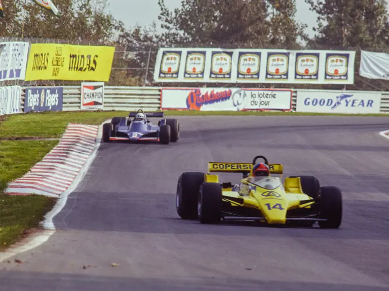 Fittipaldi pulls away from the Tyrrell 009 of Didier Pironi in Canada.
