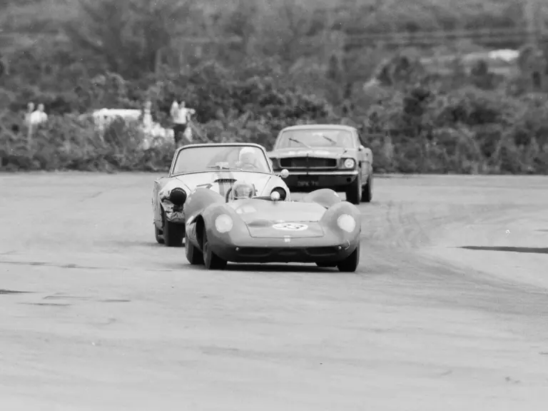 Davis, in his Lotus 30, leads Don Sesslar (damaged Sunbeam Tiger) during the Nassau Trophy in December 1964.