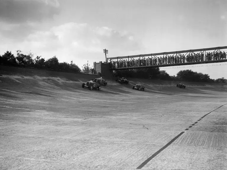 Wearing the race number 36, ‘GO51’ can be seen just behind is sister car (‘GO54’) on the banking at the 1931 Brooklands 500 Mile race. Lewis finished 2nd overall and 1st in class. 