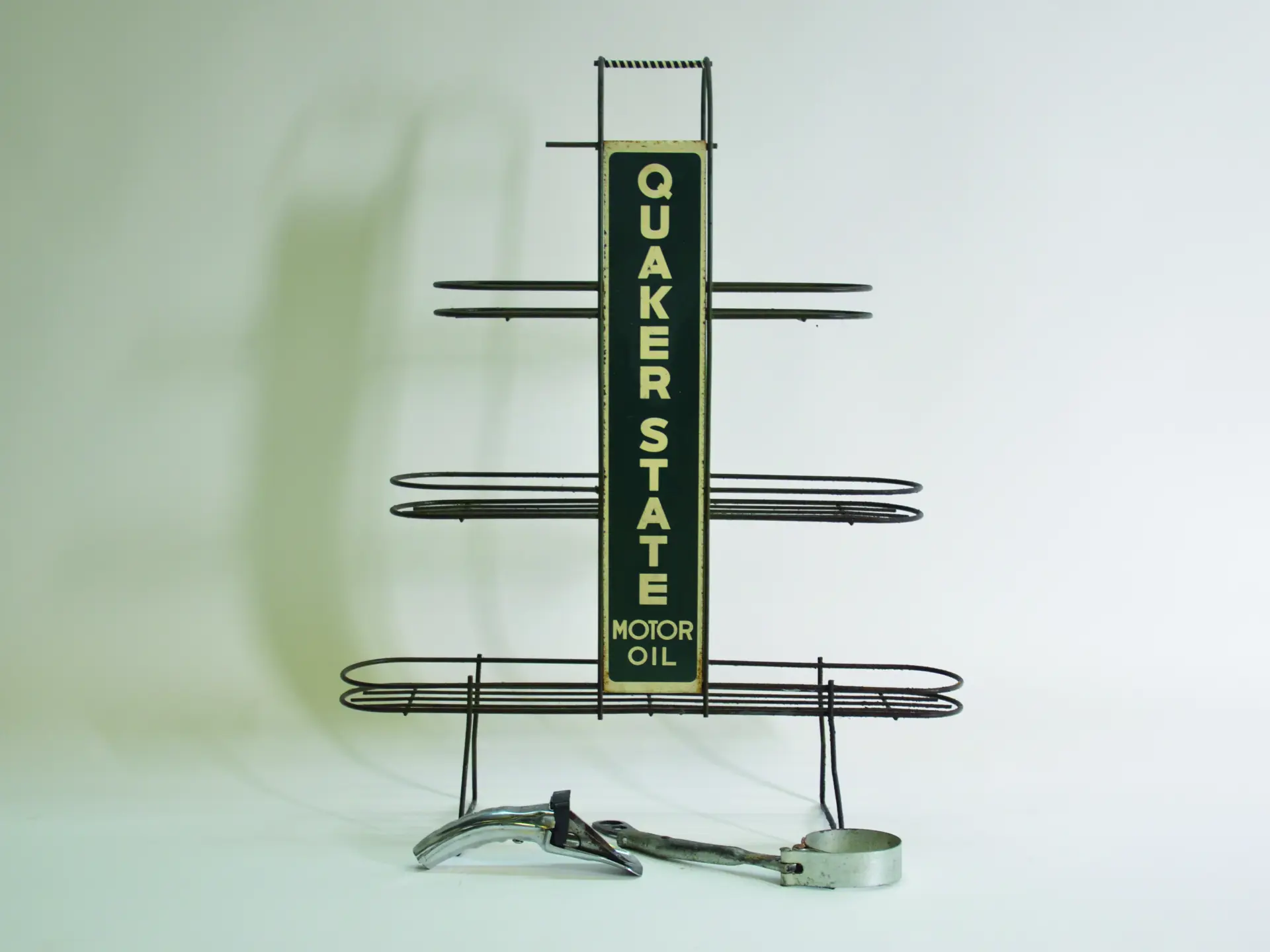 A Quaker State Motor Oil can rack. | Auburn Fall 2016 | RM Sotheby's
