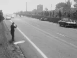 The 1963 Ferrari 250 GTE 2+2 ‘Safety Car’ responds to the upturned wreck of the René Bonnet Aérodjet.
