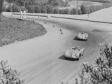 Richie Ginther behind the wheel of chassis no. 550-0089, race #211, at the 1956 Pomona Road Races.