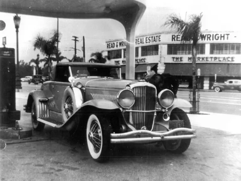 The Duesenberg at a Los Angeles gas station, 1941.