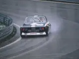 John Fitzpatrick hustles chassis 2211343 on its competitive debut to 3rd place at a sodden Salzburgring in April 1972.