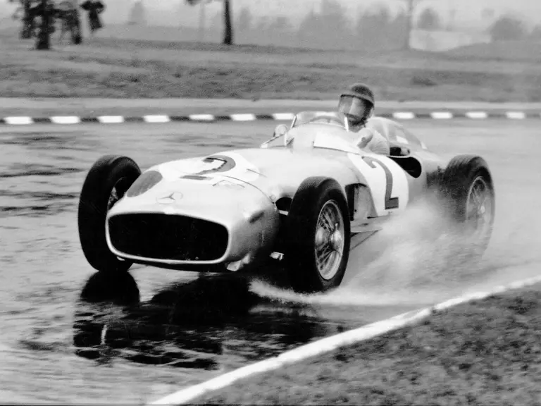  Juan Manuel Fangio (#2) drives W 196 R chassis number 00009/54 in a training run ahead of the 1955 Buenos Aires Grand Prix. For this race, run in an unusual two-heat format, the W 196 R was fitted with a 3-liter engine from the 300 SLR.