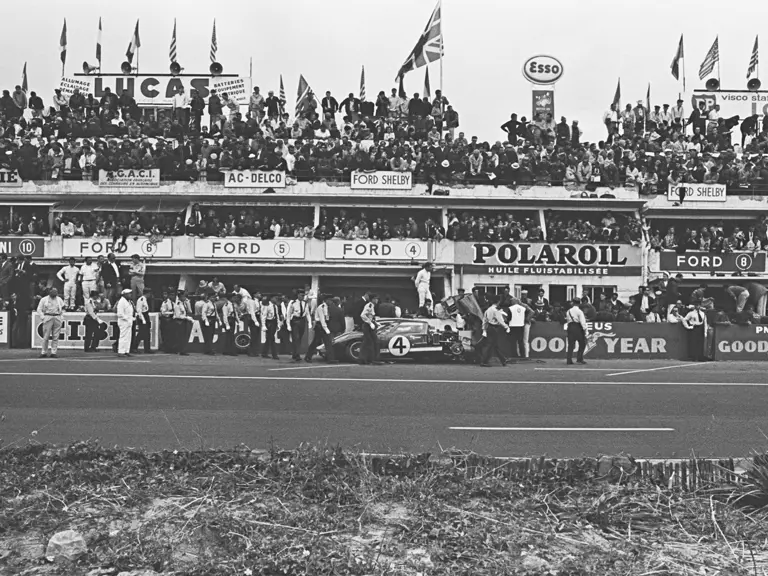 Holman-Moody’s #4 car (P/1032) driven by Mark Donohue and Paul Hawkins in the pit at the 1966 24 Hours of Le Mans.