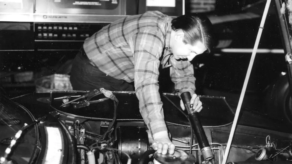 The LT1 engine is carefully lowered into the Iso Grifo at Motion Performance in 1970.