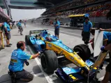 Fernando Alonso behind the wheel of chassis R24-07 during a pit stop at the 2004 Formula 1 Chinese Grand Prix.