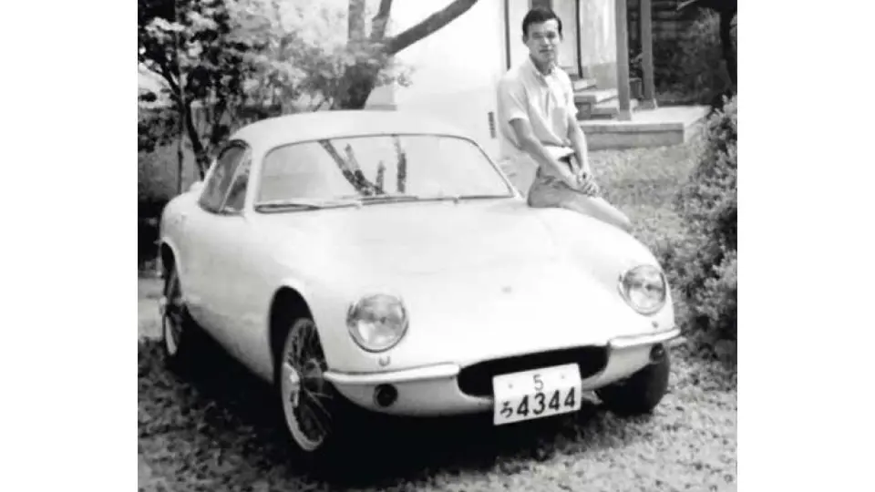 Hirotoshi Honda is pictured with the Lotus after its first rebuild, refinished in white.