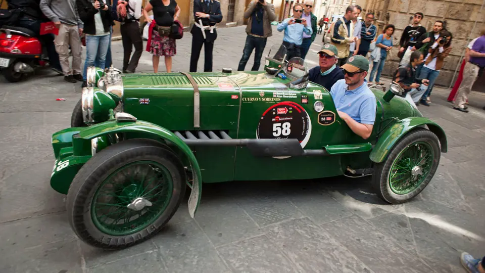 Crowds line the streets for the 2012 Mille Miglia Storica. The MG is pictured driving through the medieval city of Siena.
