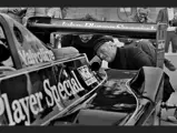 Colin Chapman inspects Mario Andretti’s pole-setting #5 Lotus 79 at the US Grand Prix, Watkins Glen, 1978.