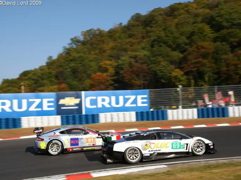 The Team JLOC Murciélago R-GT GT1 passes the Team Hong Kong Racing Aston Martin V8 Vantage GT2 in the Asian Le Mans Series race at Okayama.