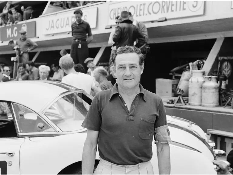 Briggs Cunningham takes a moment to pose in front of one of his three Corvettes before the 24 Hour of Le Mans begins.
