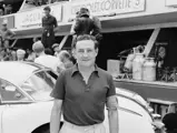 Briggs Cunningham takes a moment to pose in front of one of his three Corvettes before the 24 Hour of Le Mans begins.