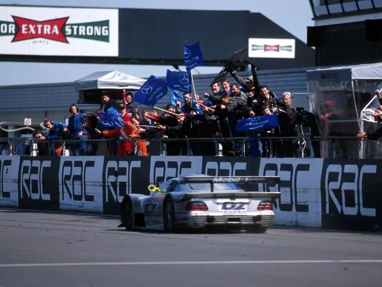 Bernd Schneider and Mark Webber pilot chassis 004 to victory at Silverstone in 1998.