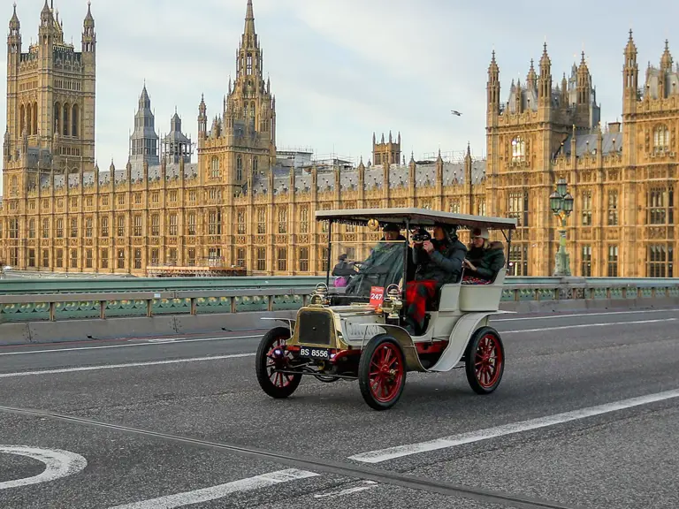The Houses of Parliament overlook Westminster Bridge at the start of the 2021 London to Brighton Veteran Car Run.
