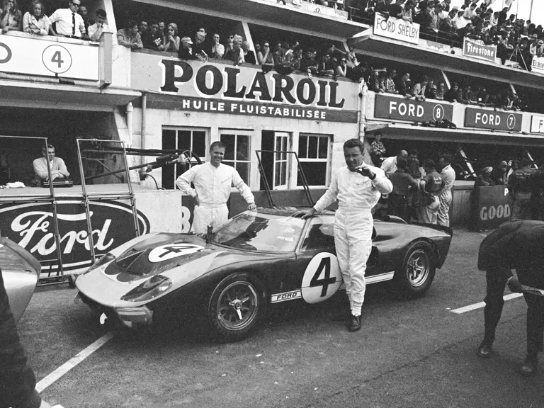 Holman-Moody’s #4 Ford GT40 Mk II (P/1032) and drivers Mark Donohue (left) and Paul Hawkins (right) at the 1966 24 Hours of Le Mans.