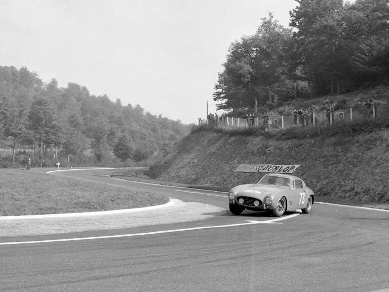 Spectators watch over the Ferrari 250 GT Berlinetta as de Portago fights to maintain the lead on the 1956 Tour de France.