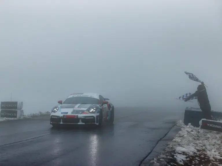 David Donner crossing the finish line behind the wheel of the Porsche 911 Turbo S Lightweight at the 100th running of the Pikes Peak International Hill Climb, June 2022.